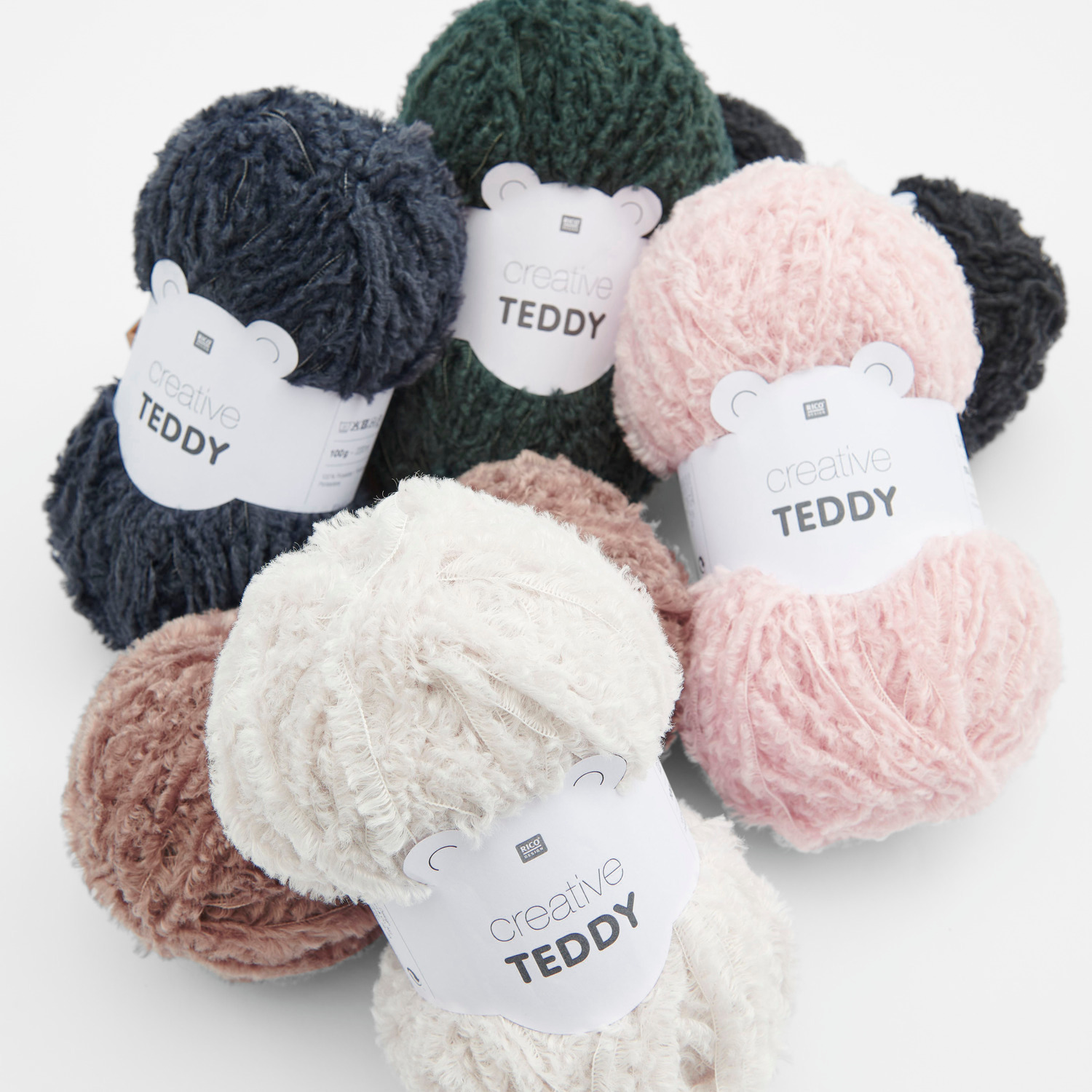 Creative Teddy Sortiment I 60-teilig 6 kg: Flauschige Wollknäuel in Creme, Rosa, Marine, Petrol, Braun und Schwarz für kreative Strickprojekte.