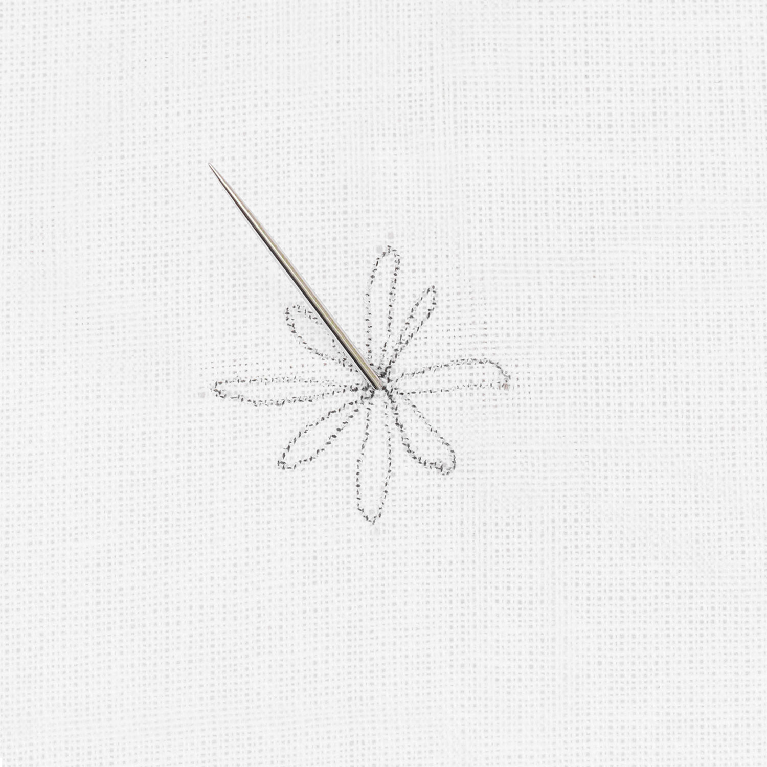 Schritt 1 in der Stickanleitung für einen Schlingenstich