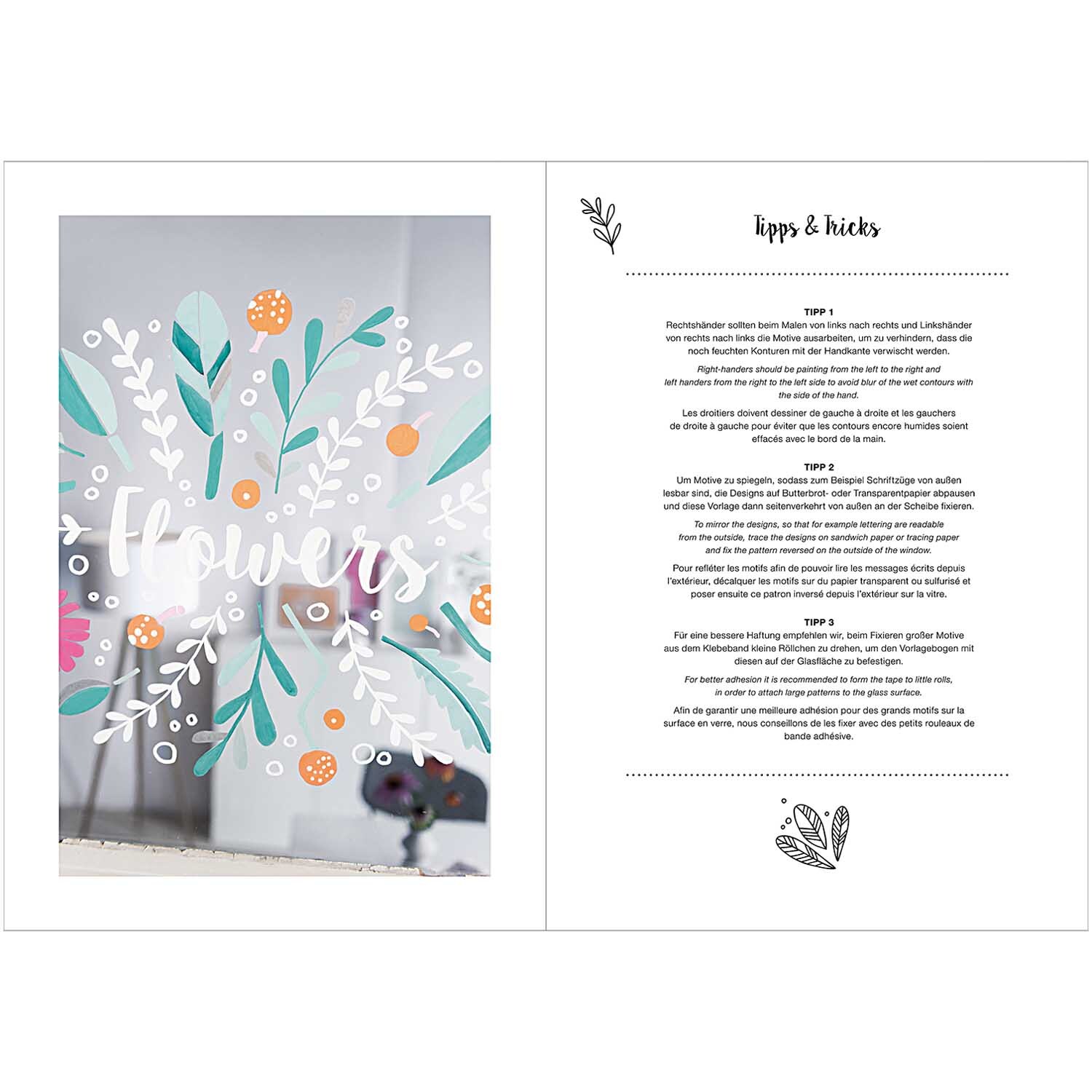 Vorlagenmappe für Fenster- und Glasmalerei mit Kreidestiften zeigt florale Designs auf Glas.