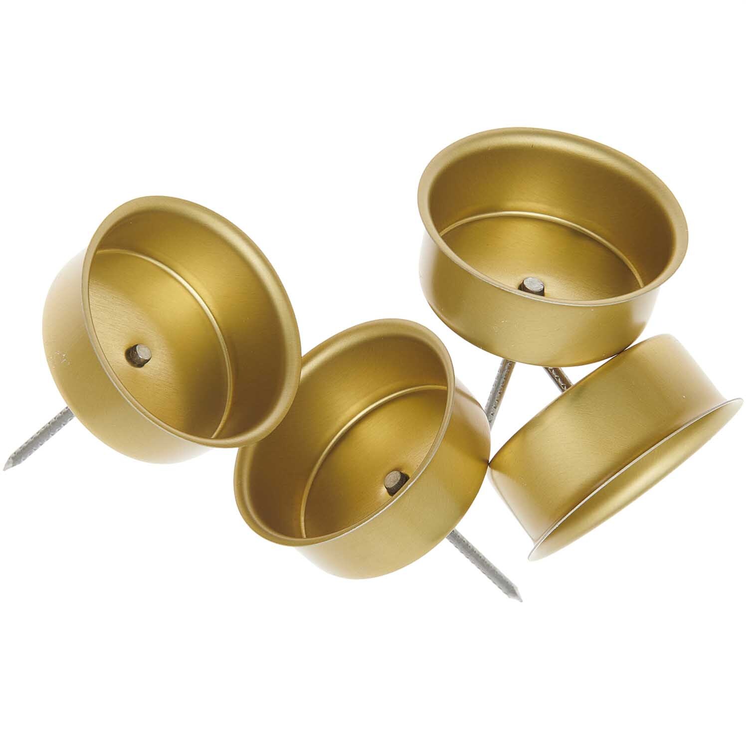 Kerzenhalter gold 4cm 4 Stück: Vier goldene Kerzenhalter mit Nägeln, ideal für festliche Dekorationen.