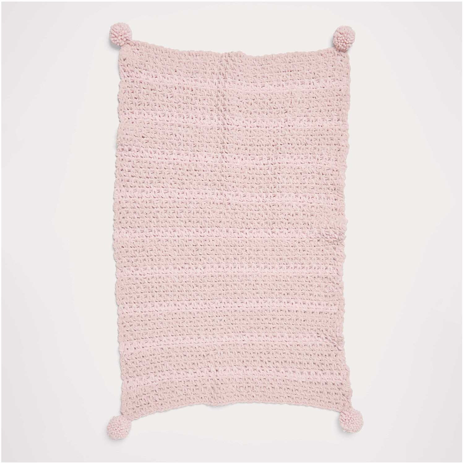 Häkelset Decke Modell 04 aus Baby Chenillove: Weiche, rosa Decke mit Pompons an den Ecken.
