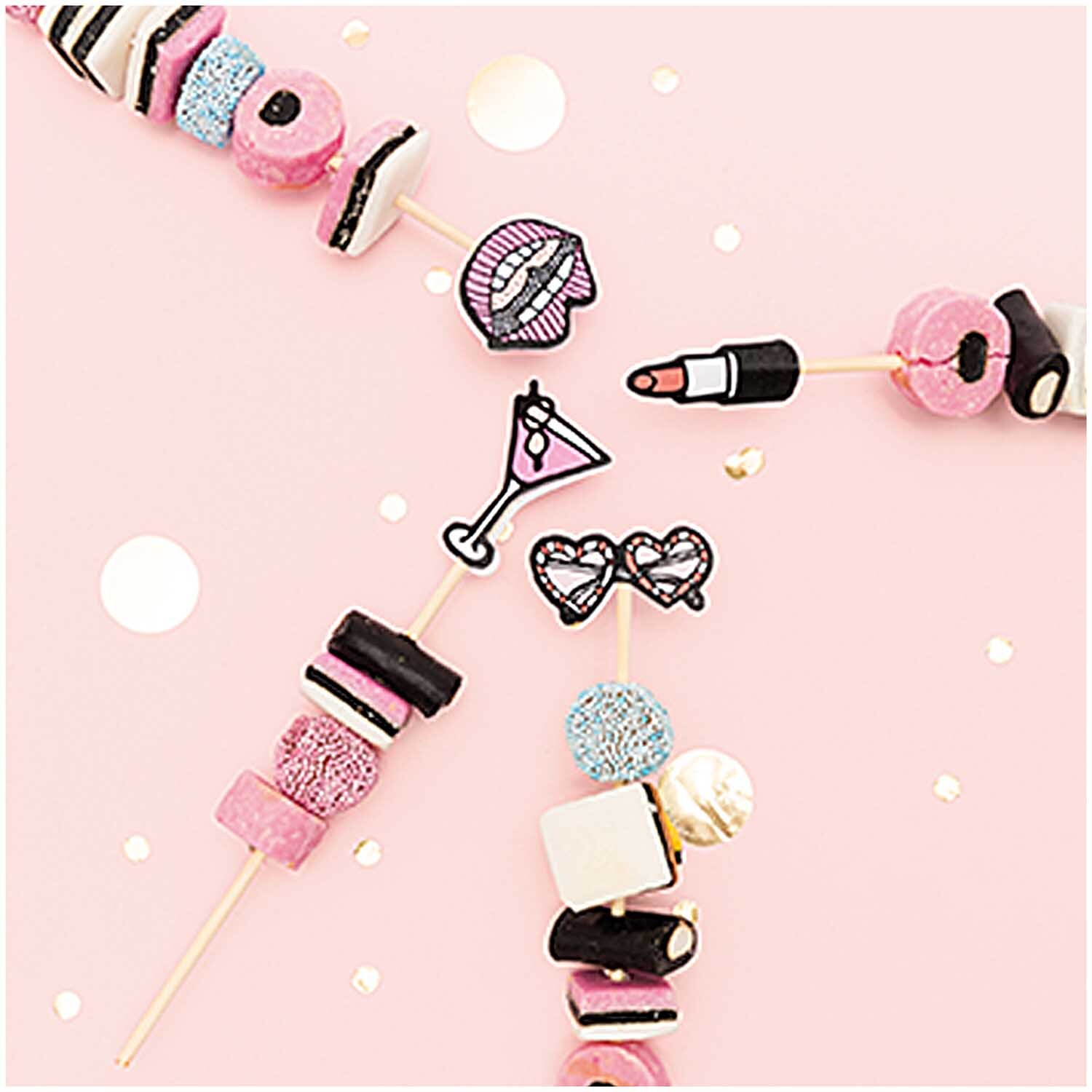 Picker Mix Girls 15cm 24 Stück auf rosa Hintergrund mit bunten Süßigkeiten und dekorativen Motiven.