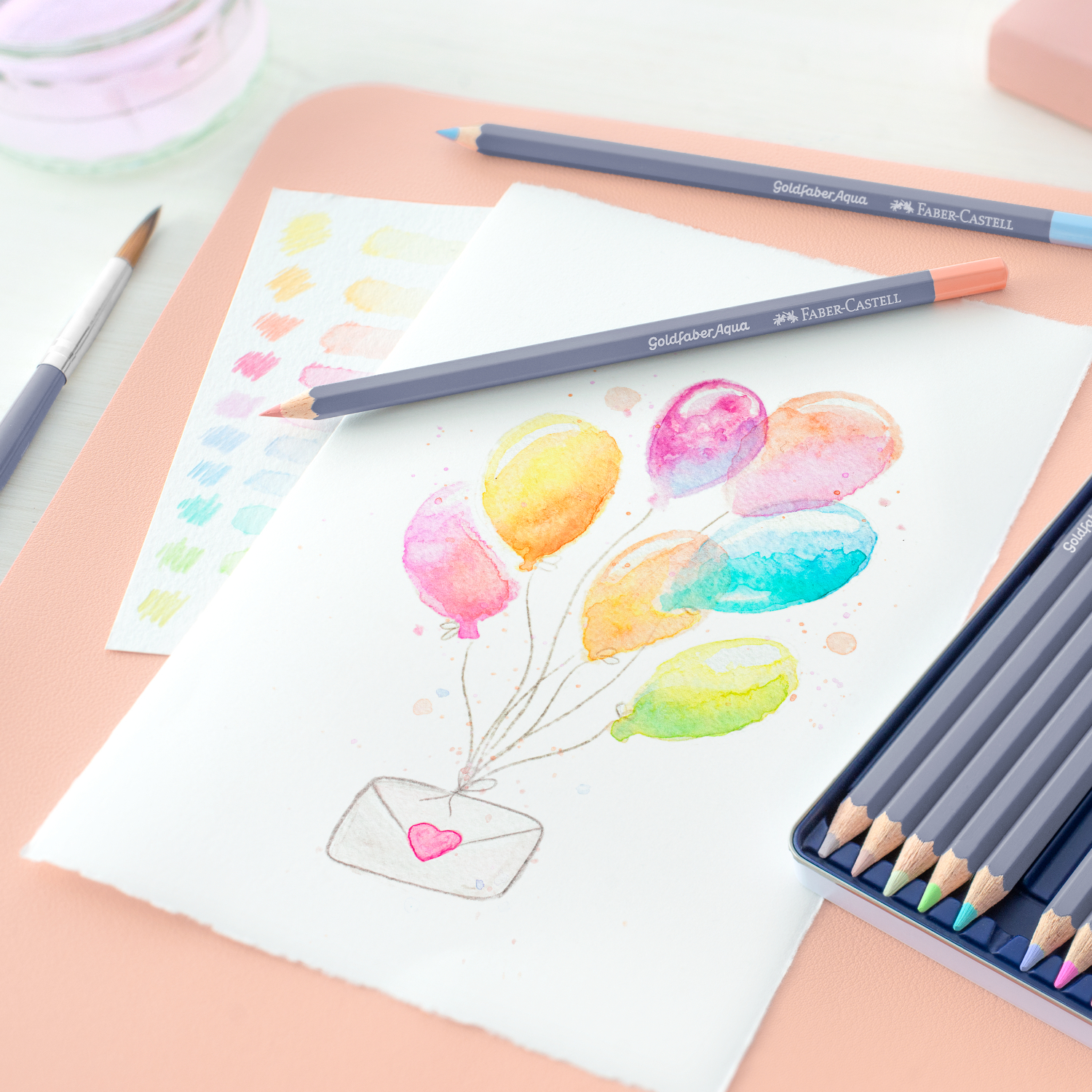 Goldfaber Aqua Aquarellstifte Pastell im Metalletui, 12-teilig. Bunte Ballons auf Papier, ideal für kreative Kunstwerke.
