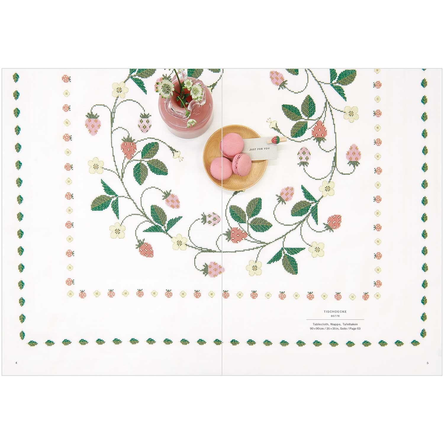Stickbuch Just Bees + Fruits + Flowers Nr. 181 zeigt ein besticktes Tuch mit Blumen- und Fruchtmotiven von Rico Design.