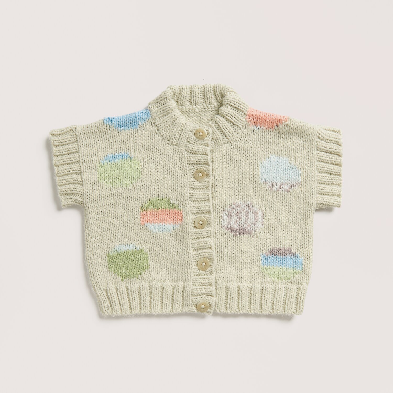Strickset Weste Modell 22 aus Baby 042 in Salbei mit bunten Mustern und Knöpfen, gestrickt aus Rico Baby Dream dk uni - A Luxury Touch.