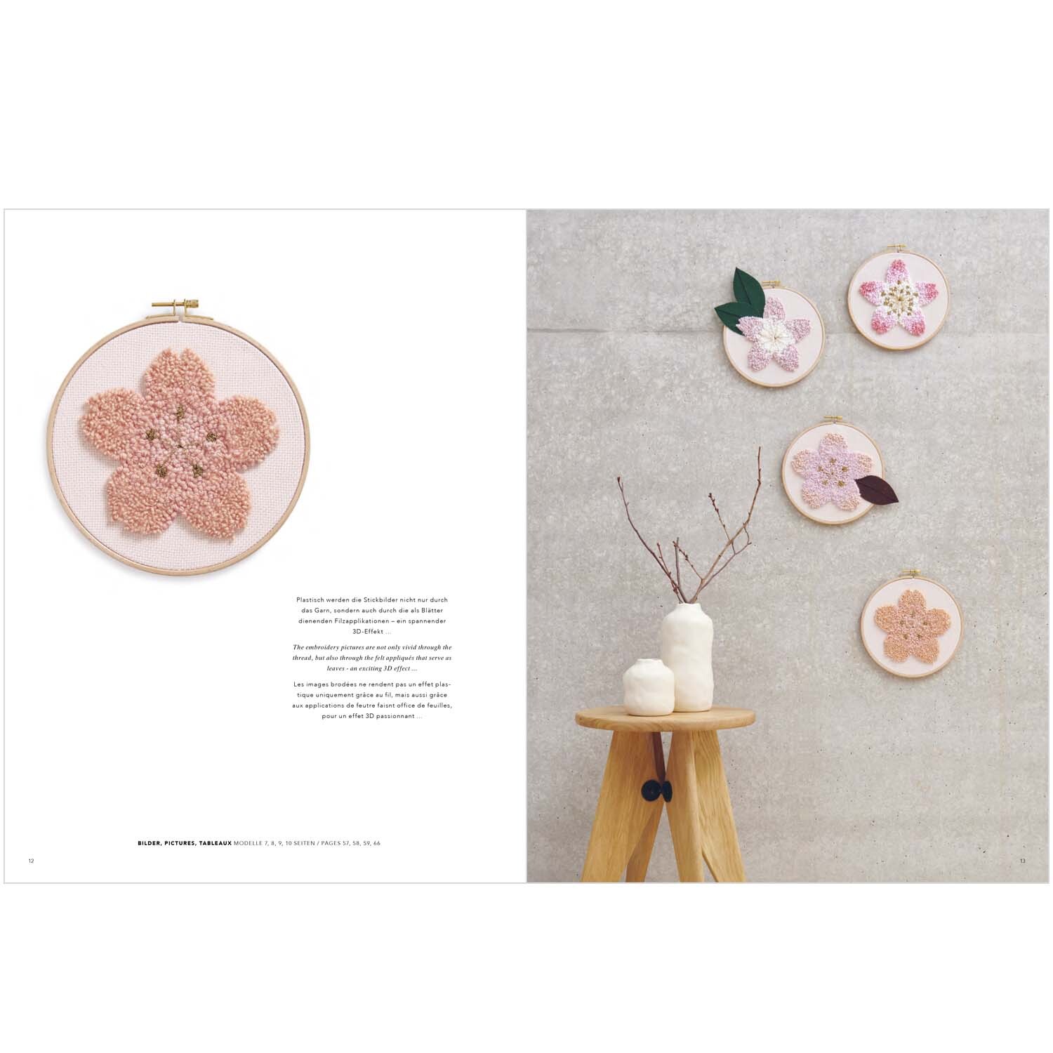 Stickbuch Punch Needle Nr. 5 Sakura Sakura zeigt florale Stickrahmen an einer grauen Wand, dekoriert mit minimalistischen Vasen auf einem Holzhocker.