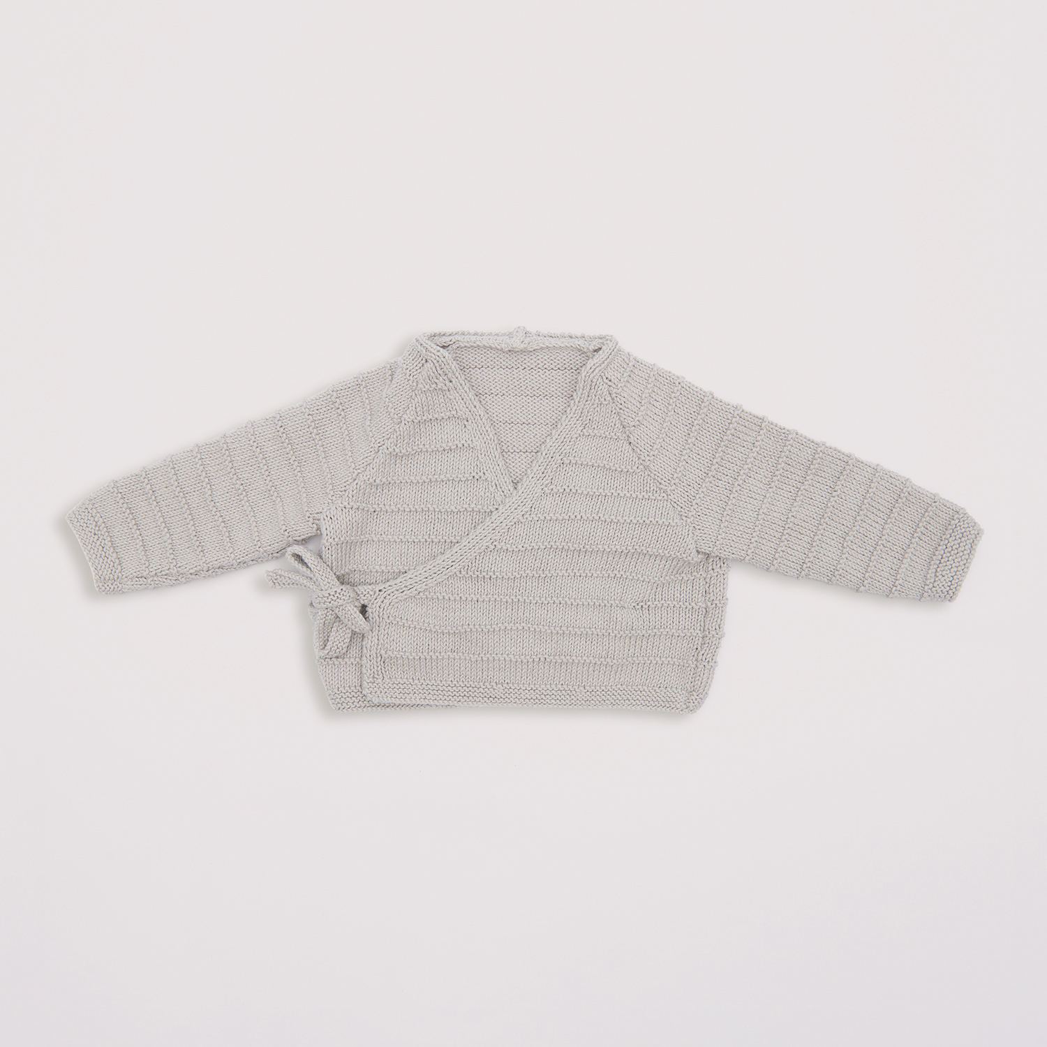 Strickanleitung Wickeljacke aus Baby Organic Cotton von Rico Design