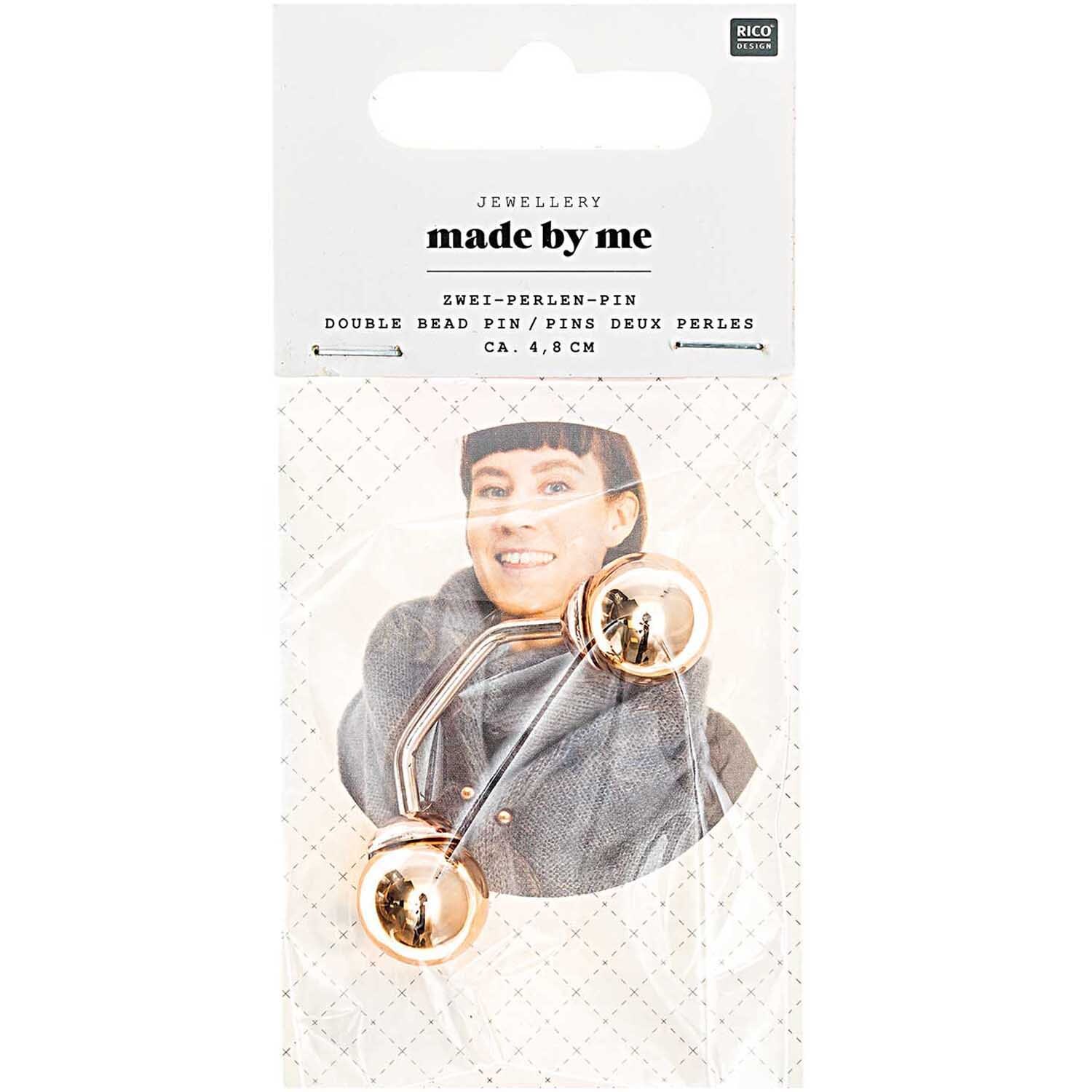 Zwei-Perlen-Pin 48mm in Roségold von Rico Design, präsentiert auf einer Verpackung mit Model.