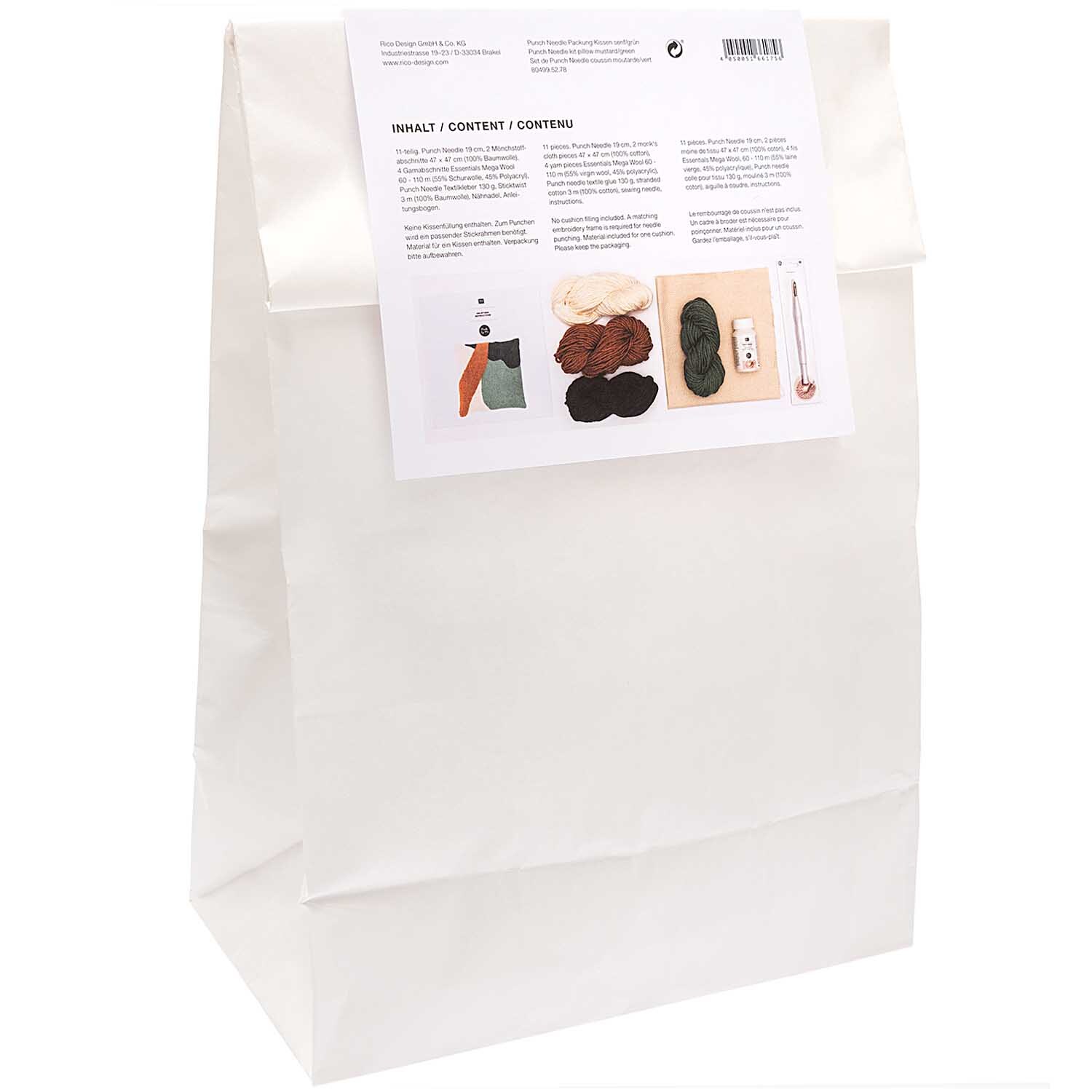 Punch Needle Packung Kissen senf-grün von Rico Design, zeigt eine weiße Verpackung mit Inhalt.