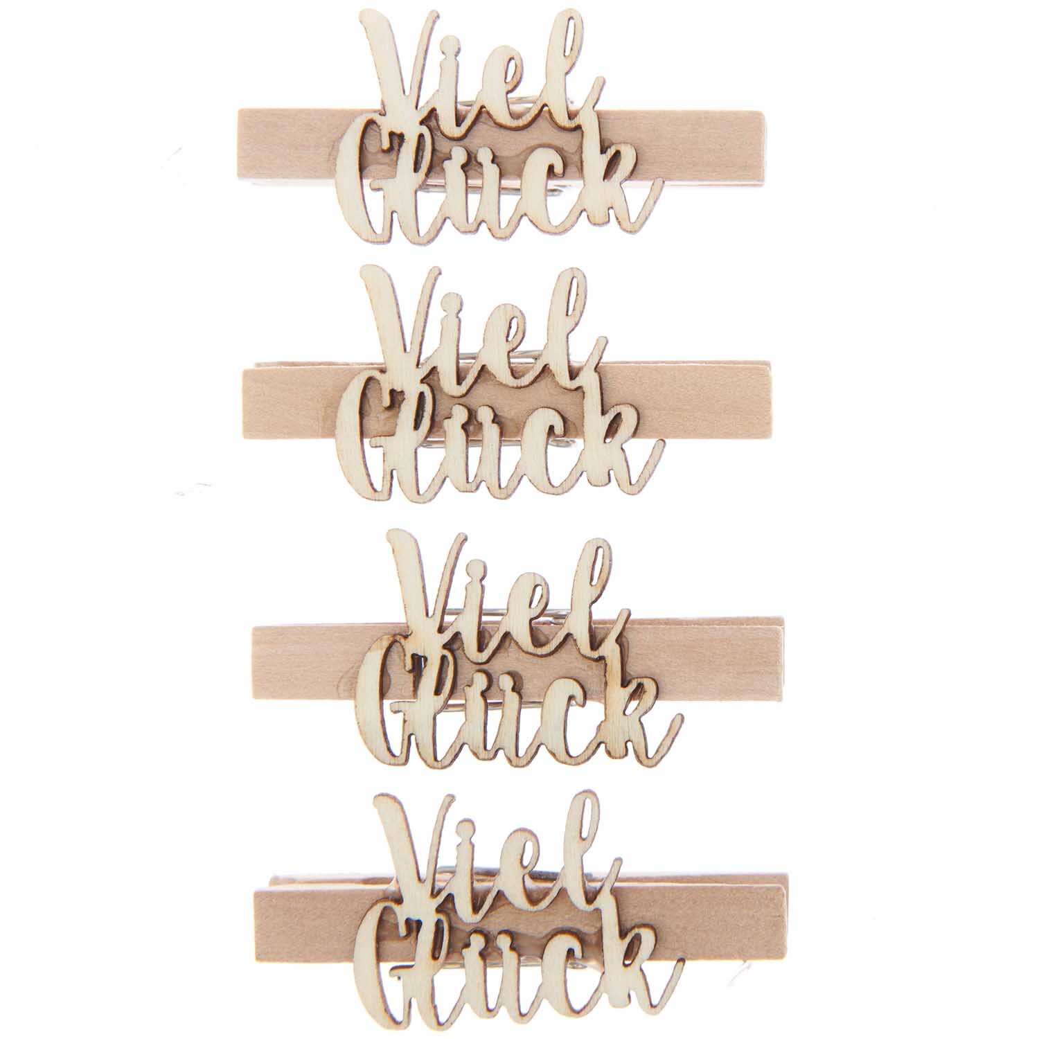 Holzklammern "Viel Glück" von Rico Design, naturfarben, 4 Stück, mit dekorativem Schriftzug.