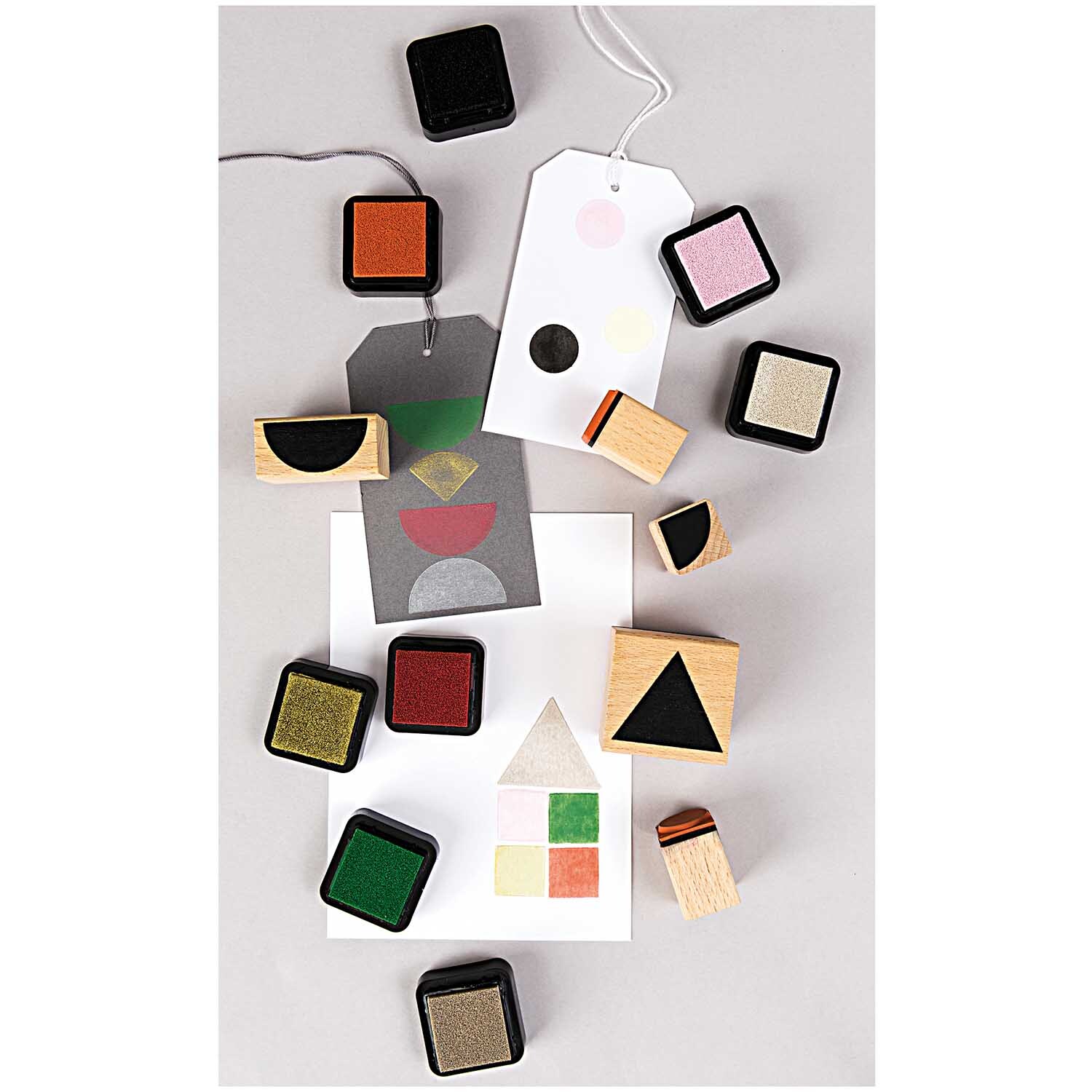 Paper Poetry Stempelset mit geometrischen Symbolen und Stempelkissen in verschiedenen Farben. Ideal für kreative Bastelprojekte.