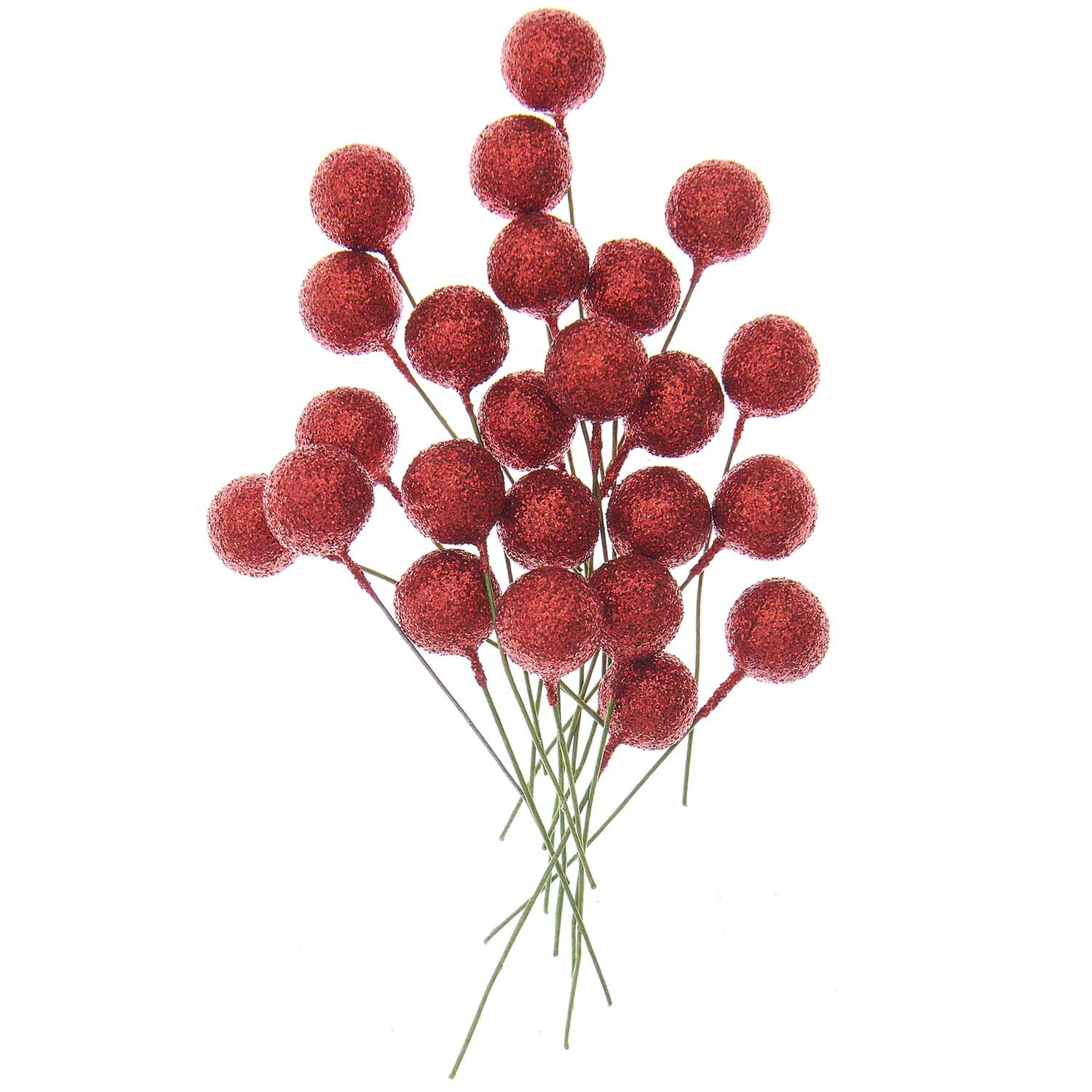 Beerenpick mit Glitzer 8,5x8,5cm 24 Stück von Rico Design. Rote, glitzernde Beeren auf grünen Stielen, ideal für festliche Dekorationen.