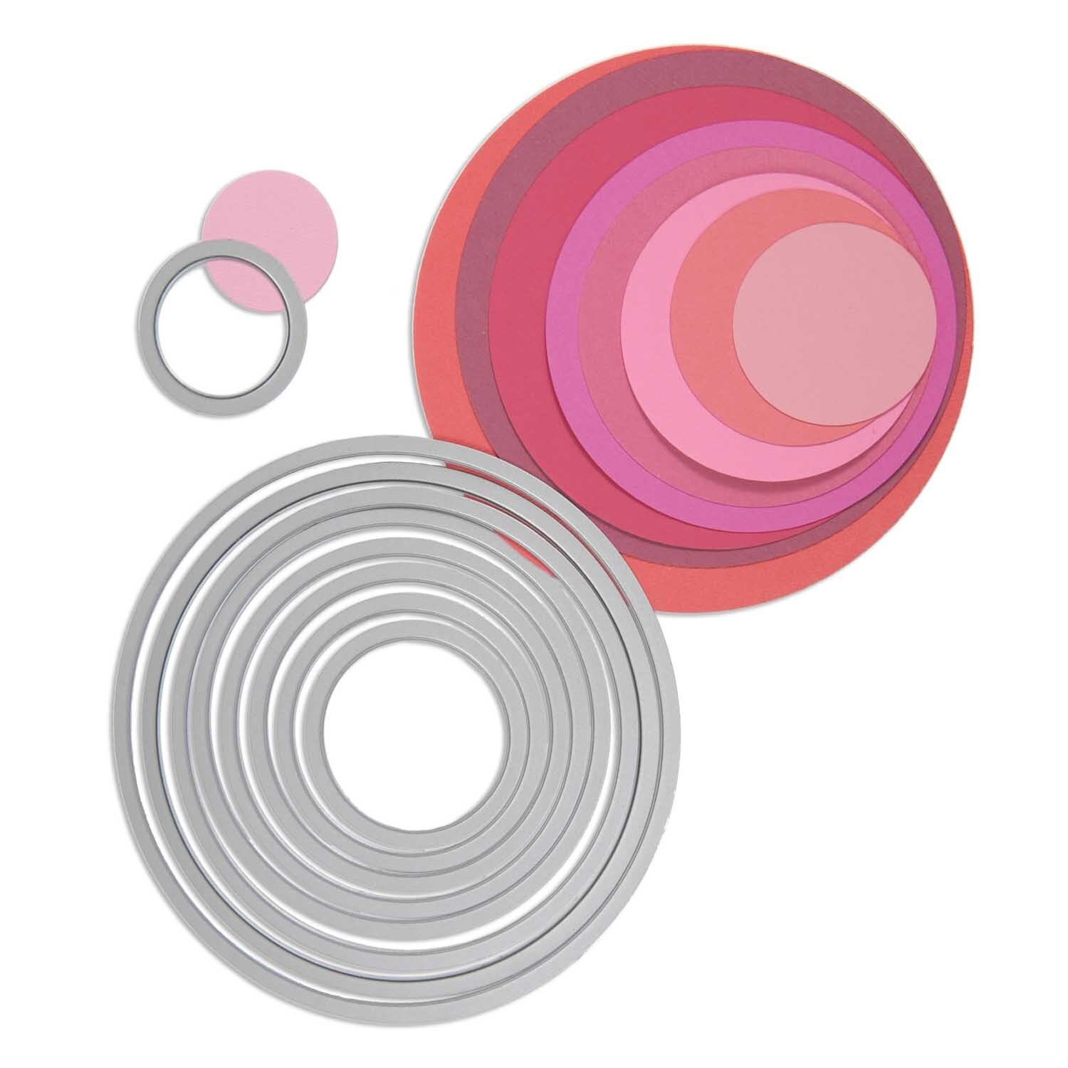 Framelits Die Set Circles von Sizzix zeigt gestapelte Kreise in Rosa- und Rottönen mit Metallschablonen. Ideal für kreative Bastelprojekte.