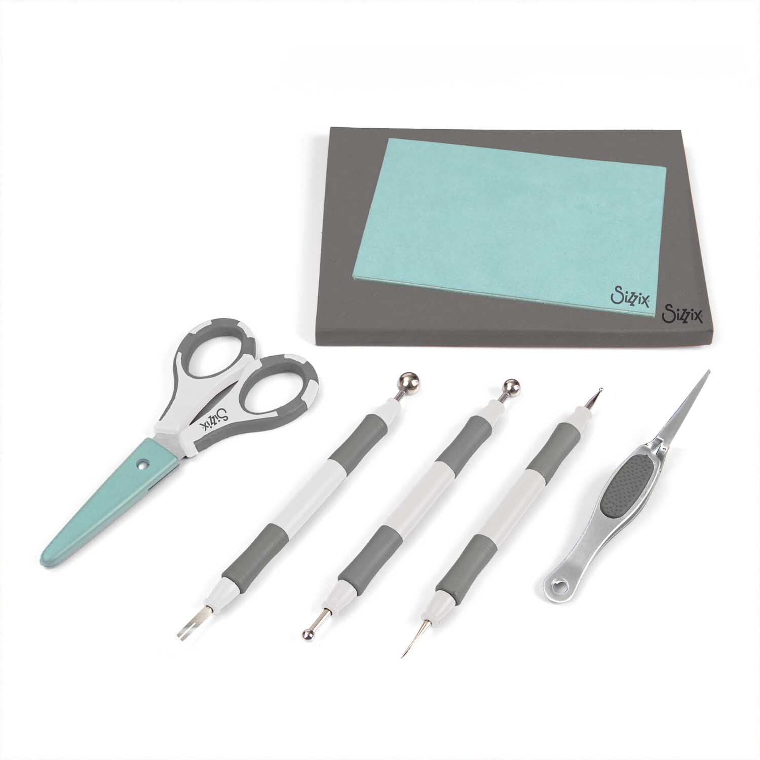 Paper Sculpting Kit mit Schere, Werkzeugen und Papier auf weißem Hintergrund, Marke Sizzix.