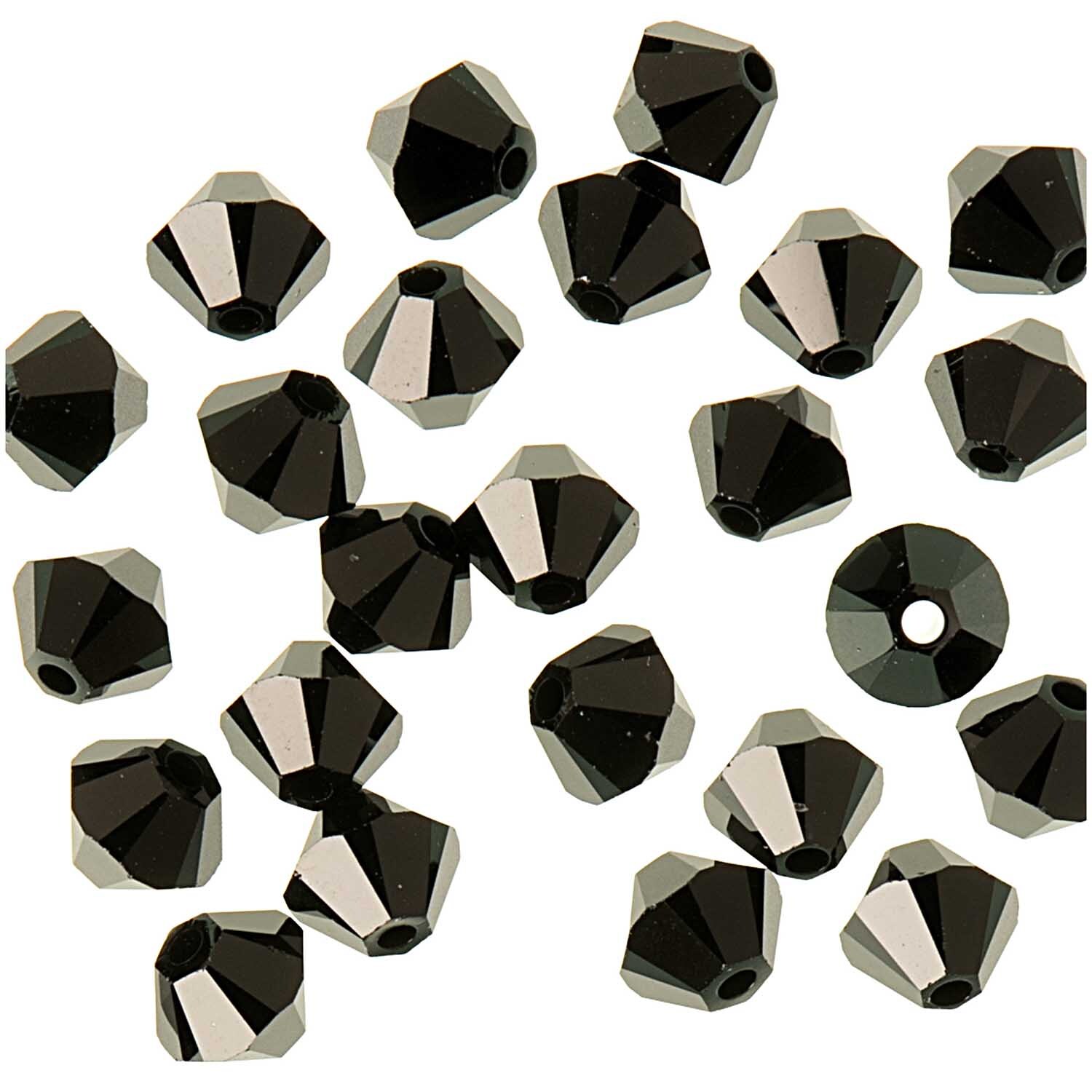 Glasschliff-Perle jet 4mm 25 Stück von Rico Design, schwarze facettierte Perlen auf weißem Hintergrund.